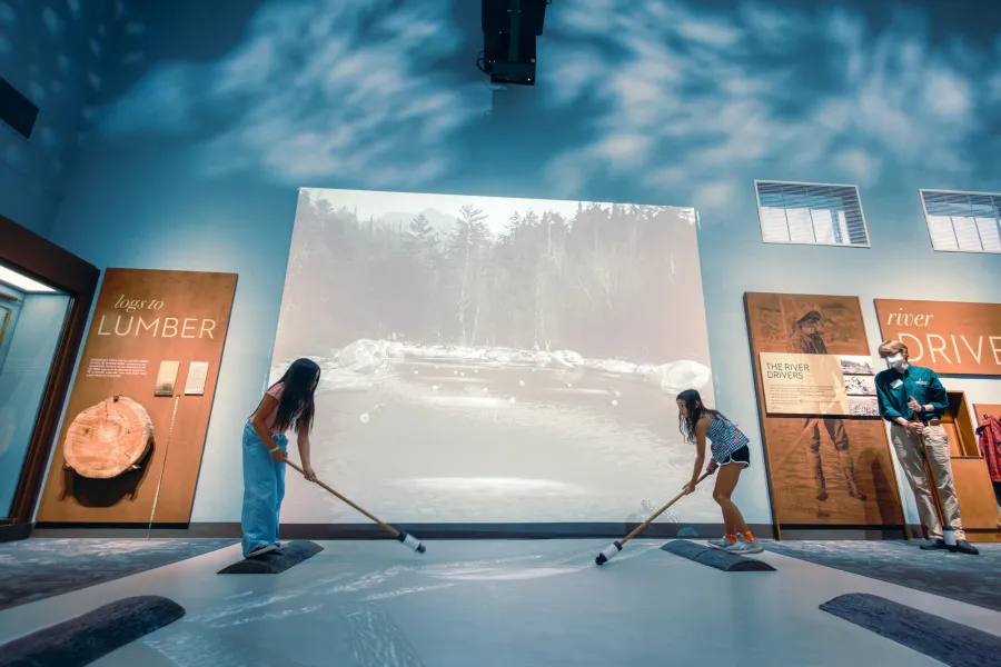 Two kids at an interactive museum exhibit