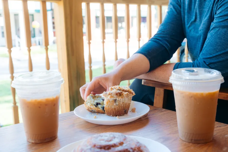A couple coffees on an outdoor table