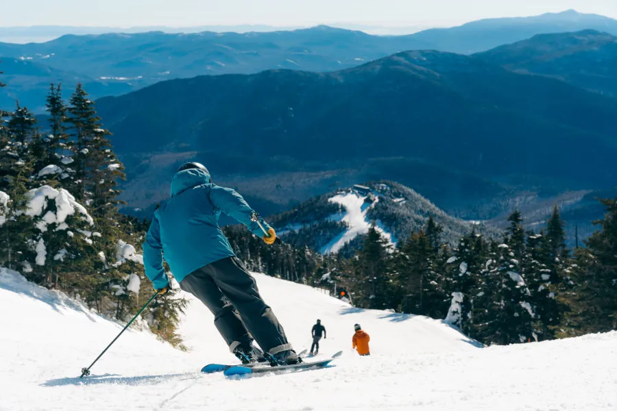 Someone skiing down a mountain
