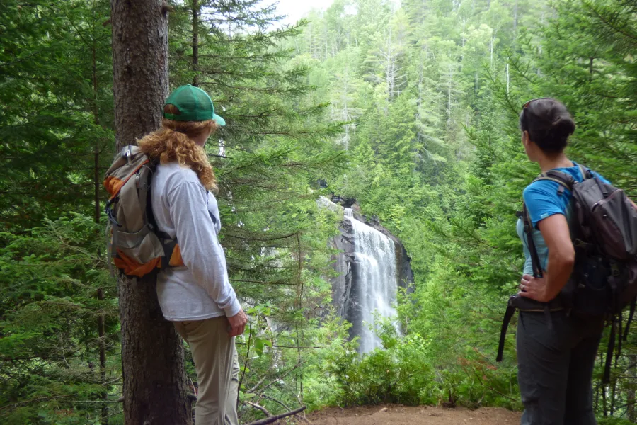 Two hikers at OK Slip Falls in Indian Lake.