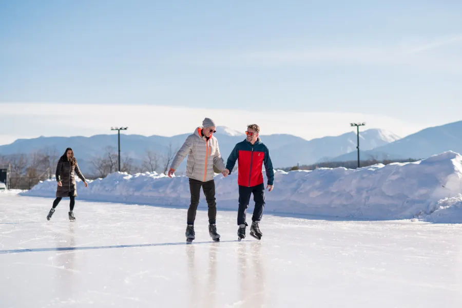 Two people skating on the outdoor oval in Lake Placid