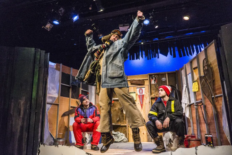 A skit being done about ice fishing in a theatre