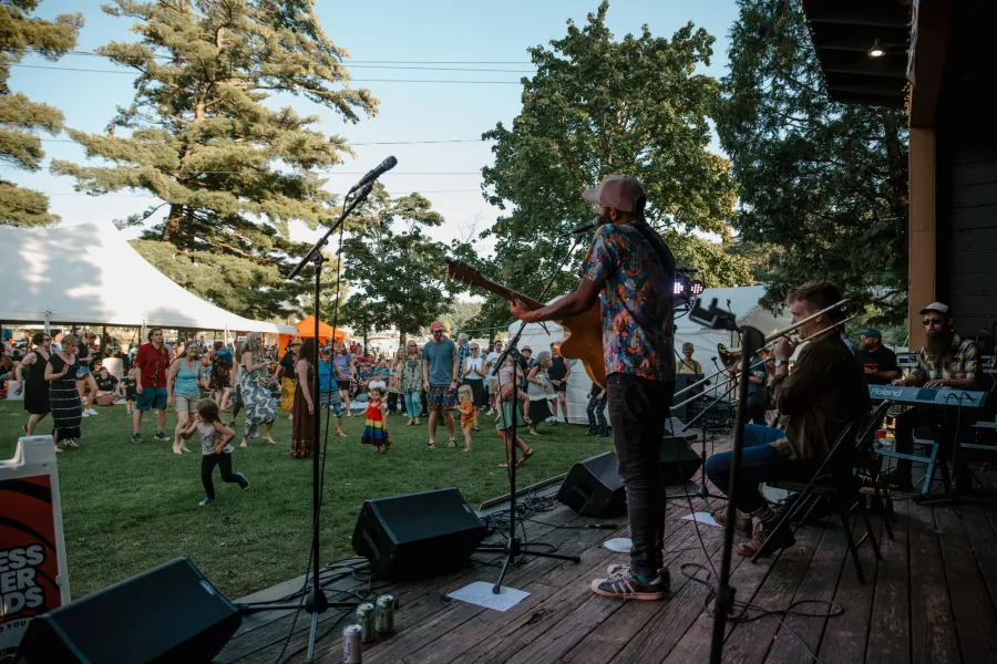 An outdoor concert by Lake Flower