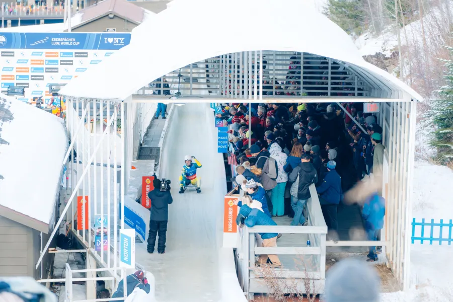A luge event with a crowd