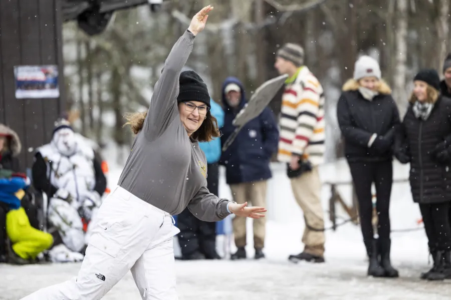 A woman throwing a frying pan