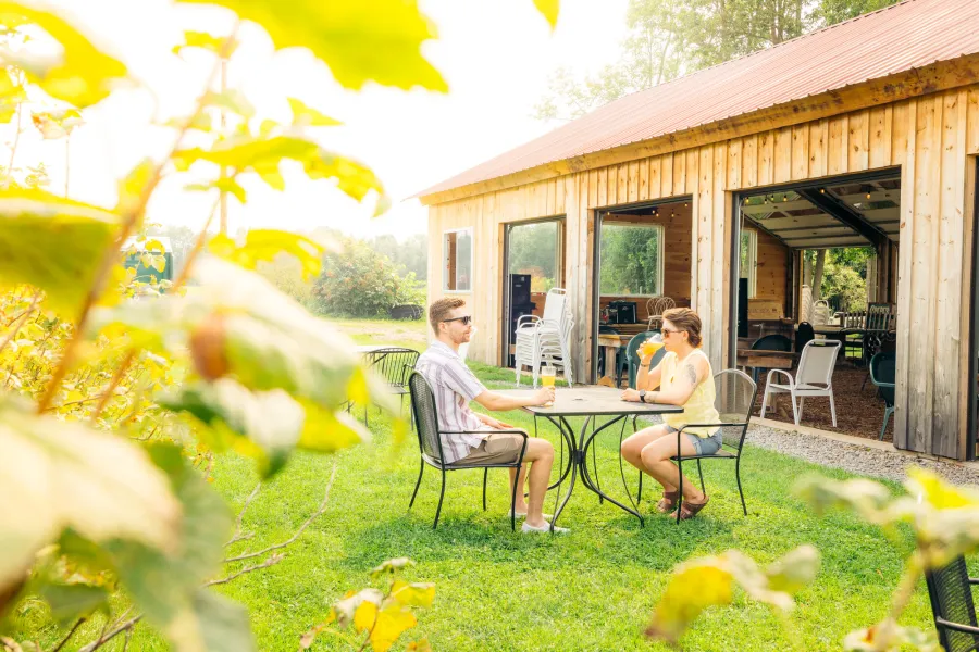 A couple outdoor dining and having a beer