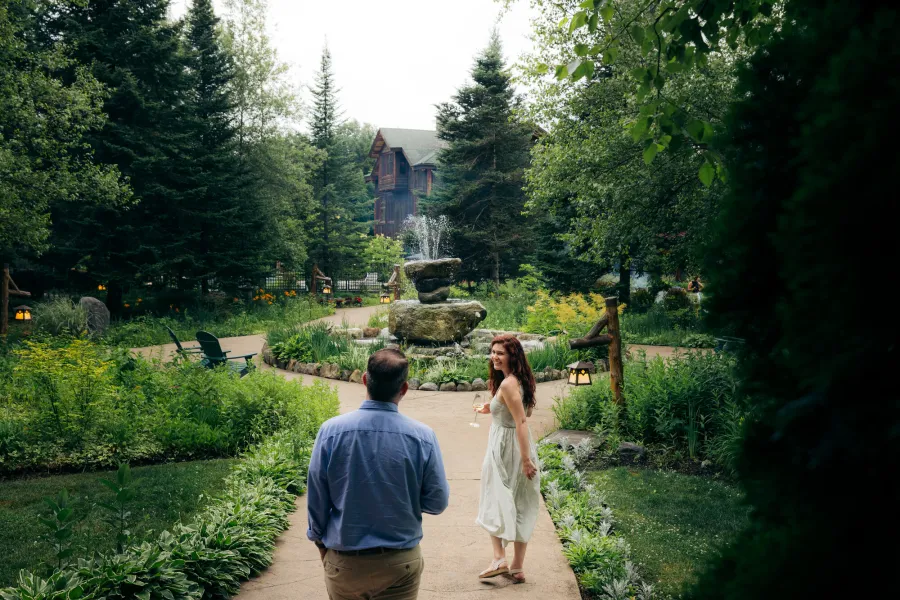 A couple in a beautiful courtyard with a water fountain