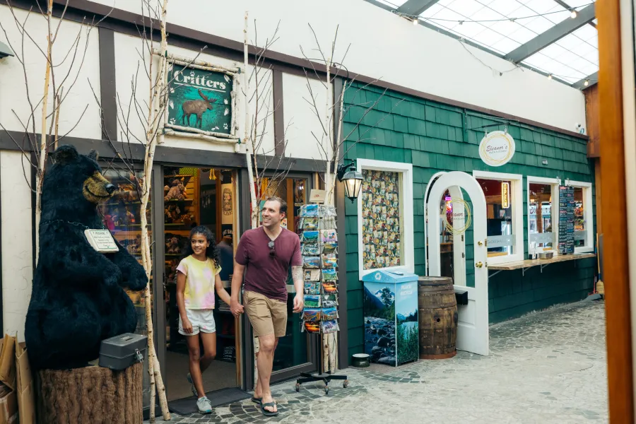 A father and daughter in a shopping area