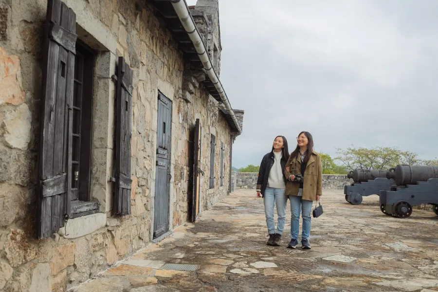 Two people walking around Fort Ticonderoga