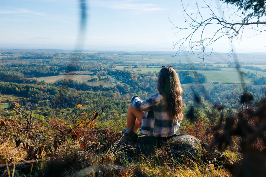 A hiker at an overlook in the fall