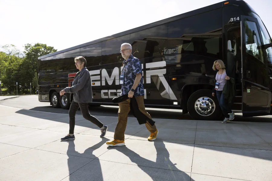 People getting off a charter bus