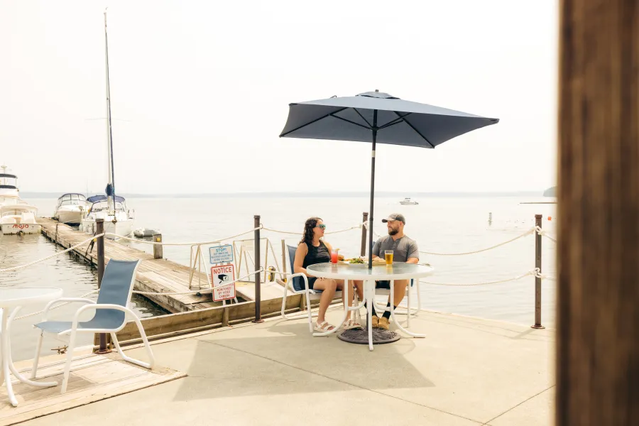 A couple dining at a marina in Westport.