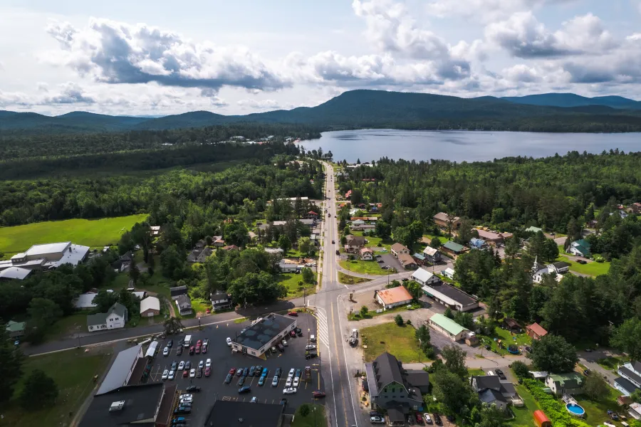 Aerial view of a mountain town by a lake