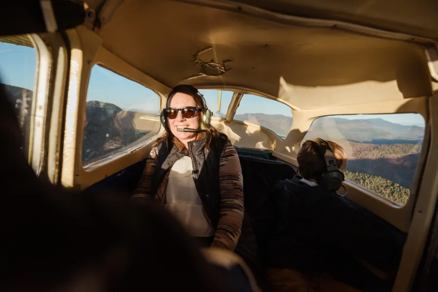 A woman taking a scenic flight