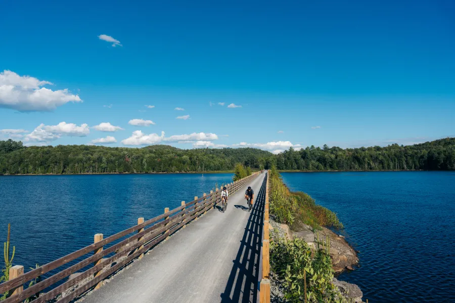 Two cyclists on the Rail Trail in the summer