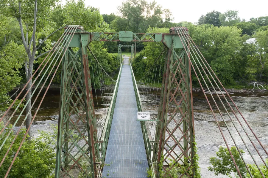 An old iron suspension bridge in Keeseville