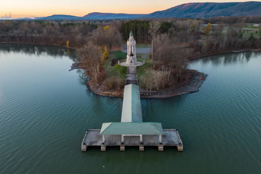 Aerial view of a lighthouse and large pier