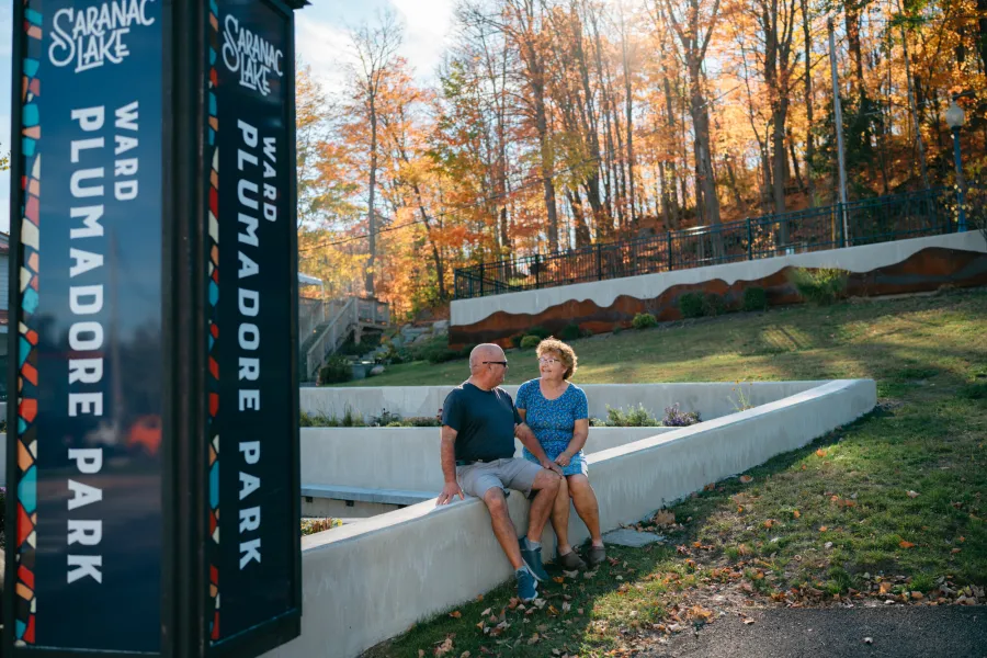 An older couple at a park in the fall
