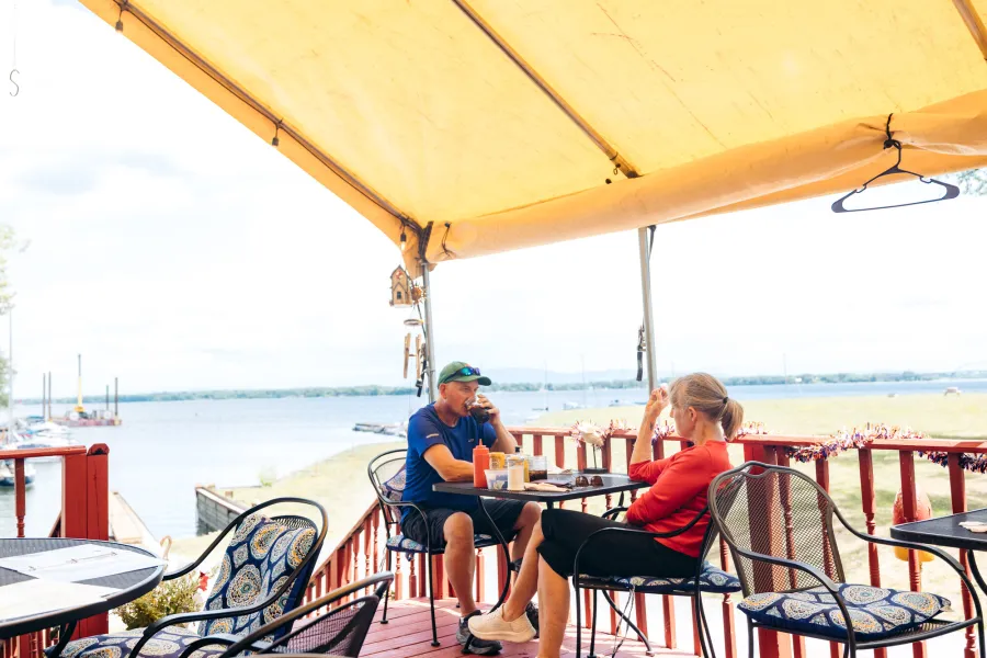 A couple eating lakeside in Port Henry