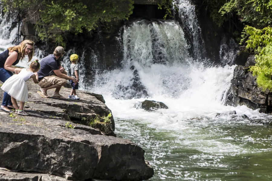 A family on a waterfall hike.
