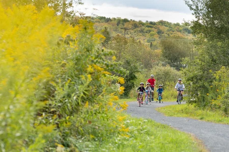A family biking on the Rail Trail.