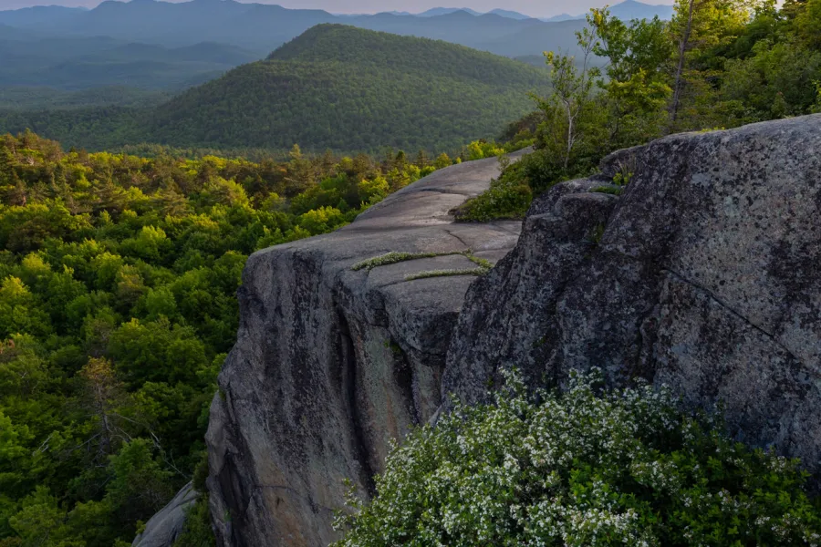A look from the top of a mountain to a nearby mountain range. 