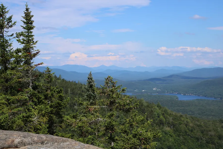 A view of a lake from a mountain. 