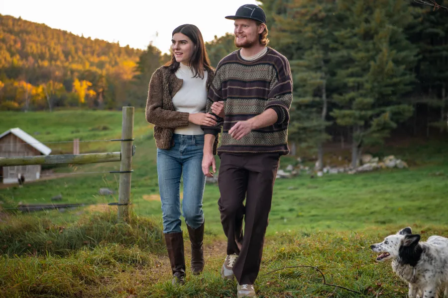 A couple at a farm in the fall.