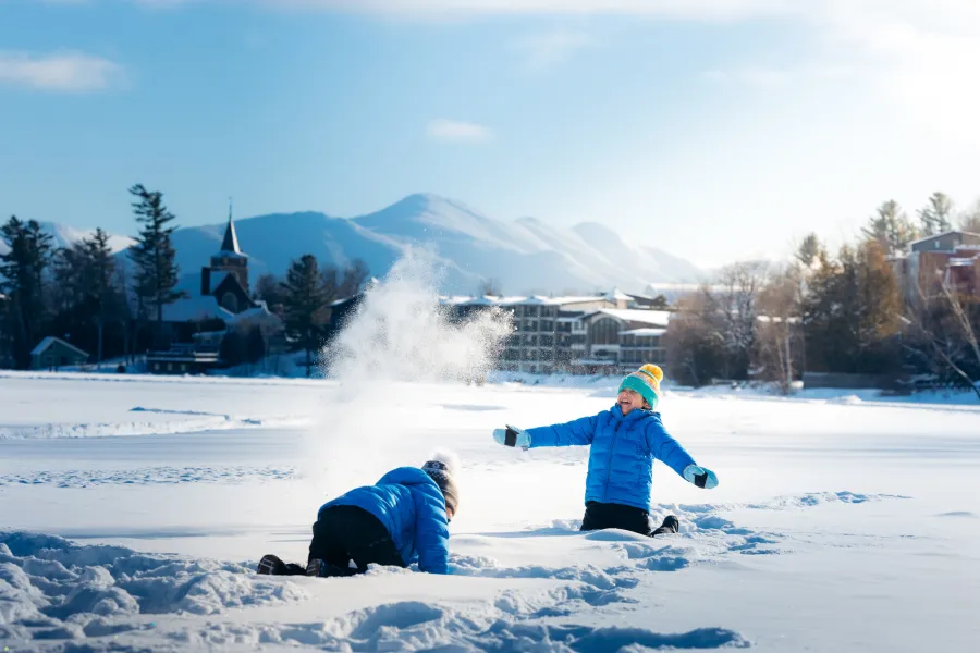 Kids playing in the snow in Lake Placid.
